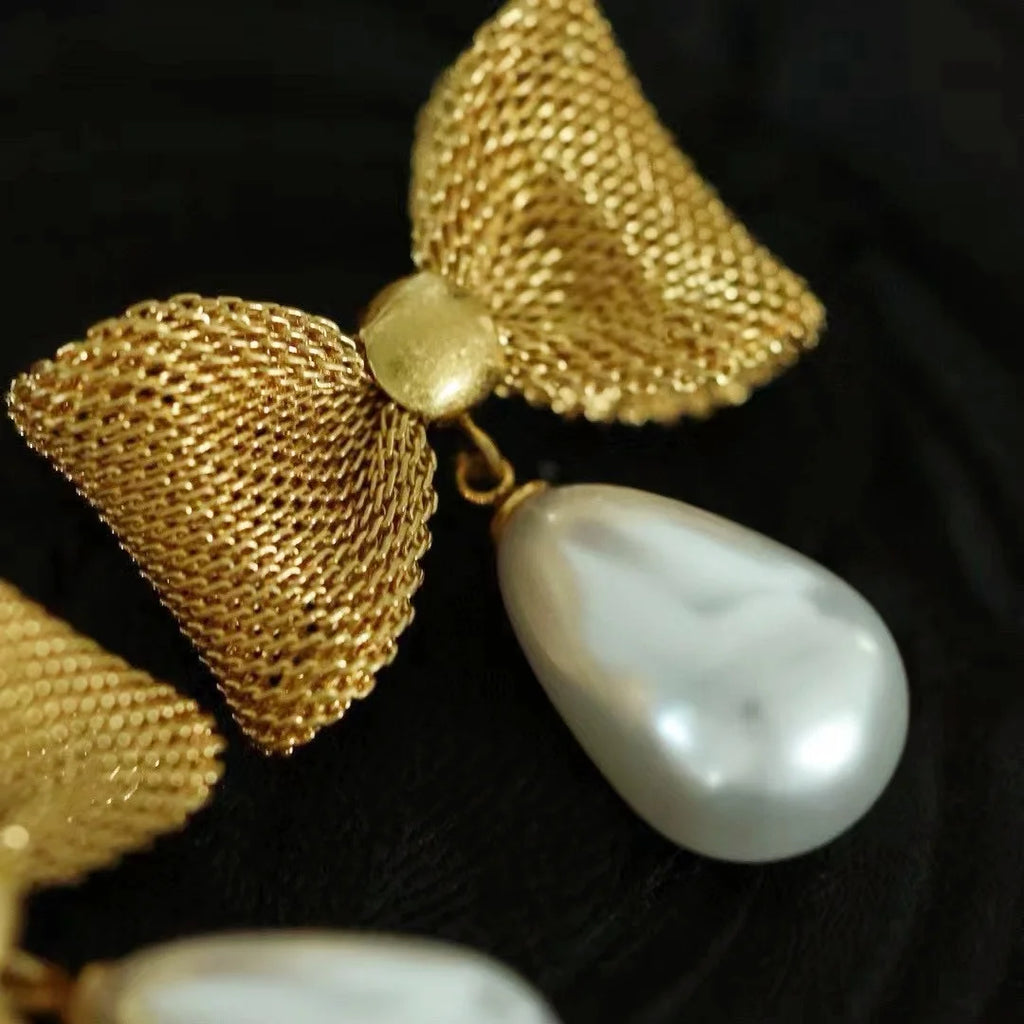 The famous designer's new copper Du true European and American French water drop pearl bow vintage earrings